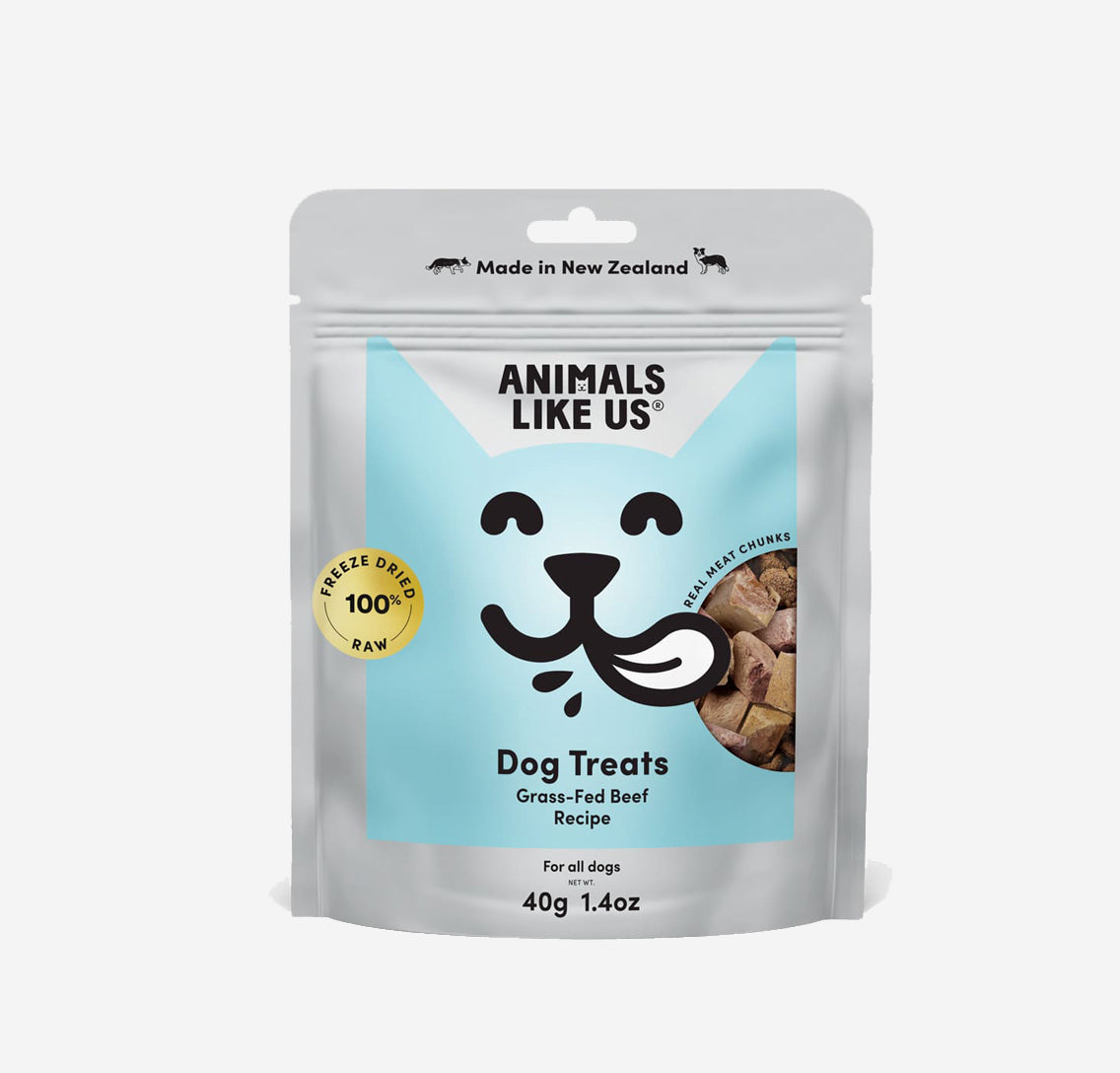 A package of 'Animals Like Us' dog treats with a stylized cat face and beef chunks images.