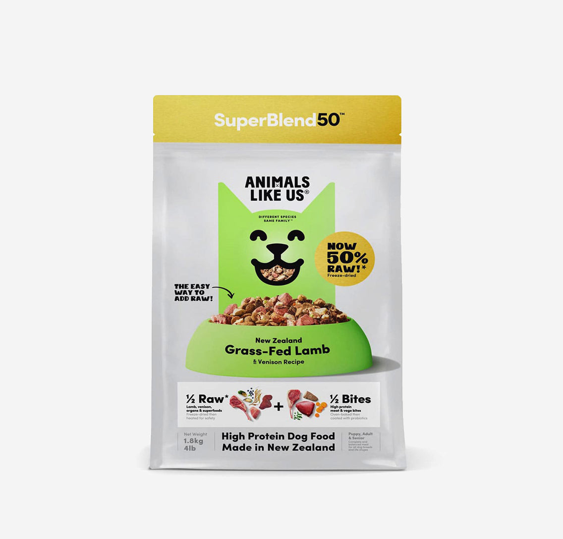 Bag of SuperBlend50 dog food featuring a green cat design, labeled with grass-fed lamb and venison recipe, highlighting 50% raw content.