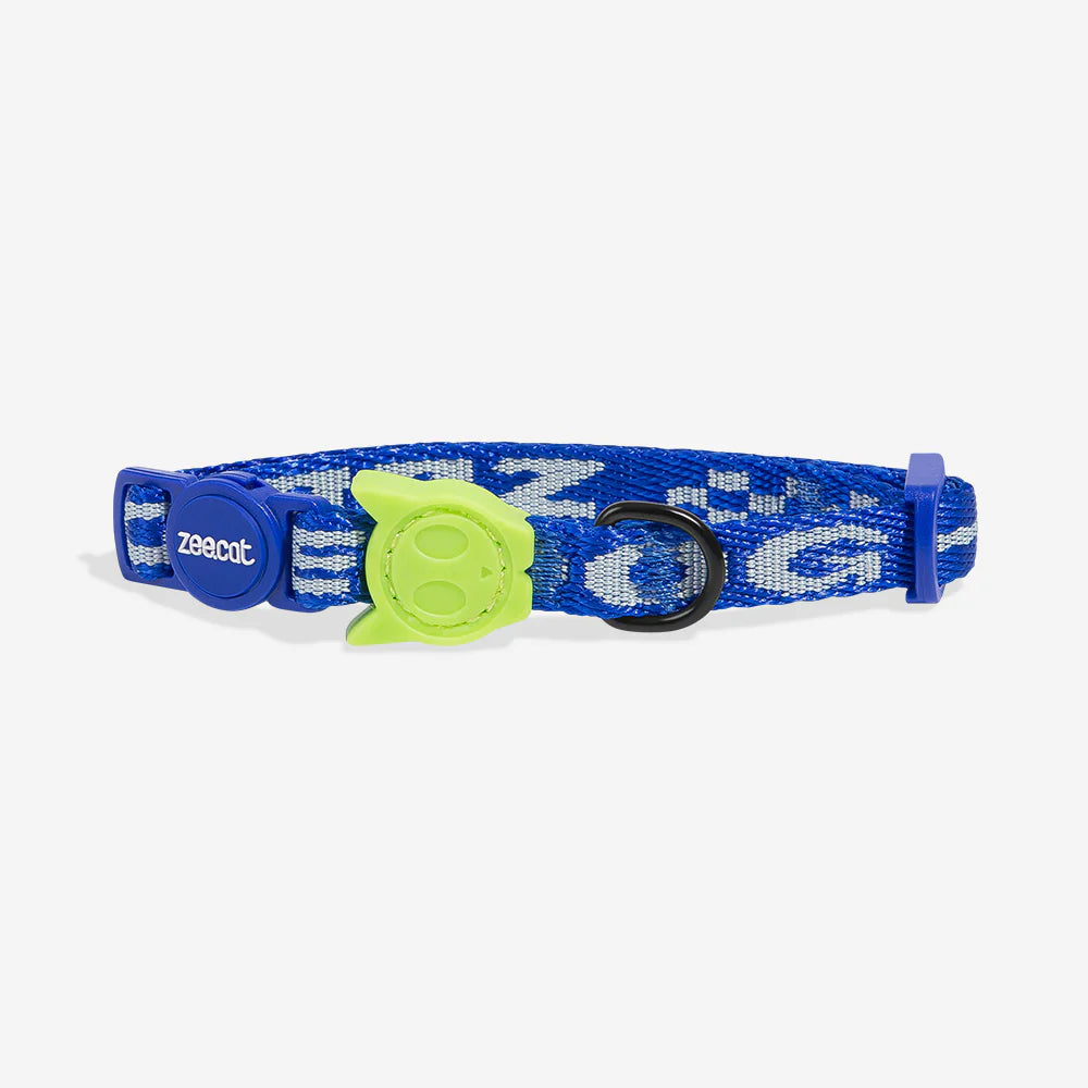 Blue cat collar with green cat skull -shaped breakaway clasp and bell.