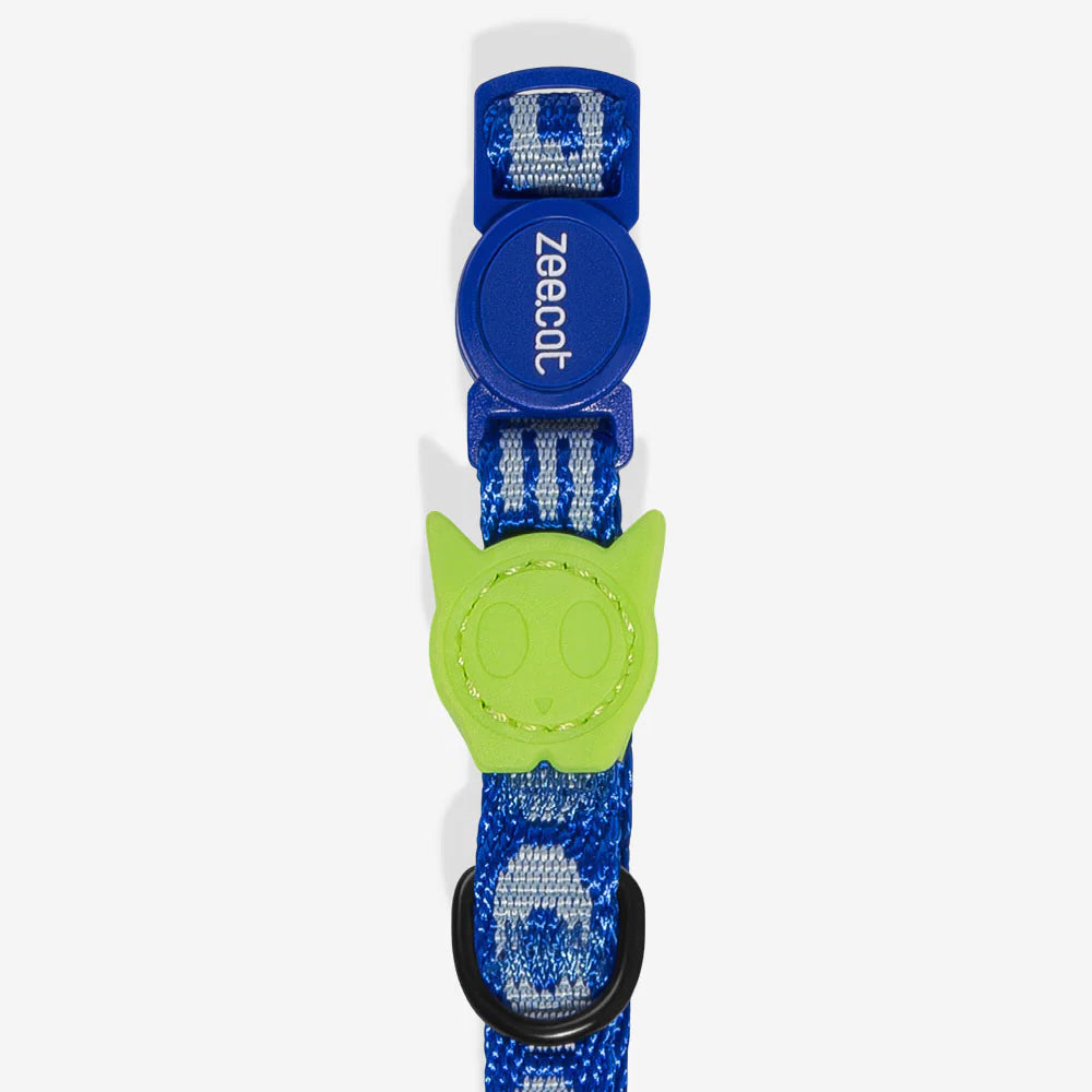 Blue cat collar with green cat skull -shaped breakaway clasp and bell.