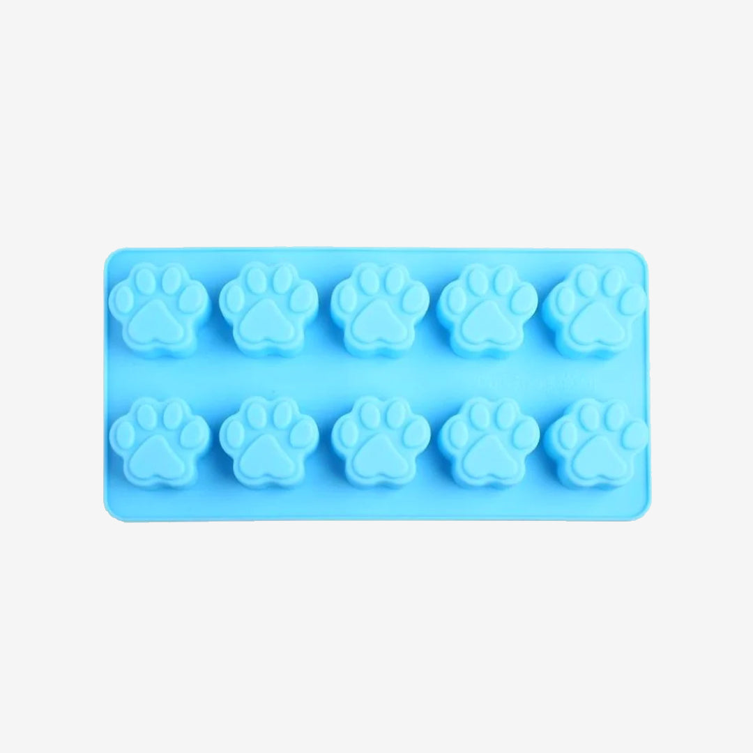 Light blue silicone mold with ten paw print shapes, ideal for making treats or ice cubes in a pet-themed design.
