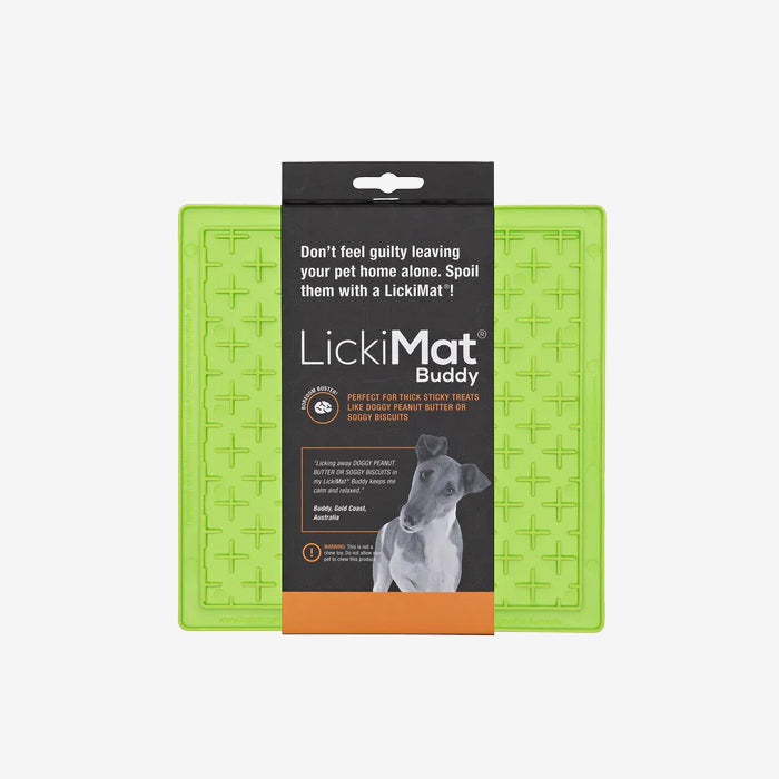 LickiMat Buddy in bright green, designed for pet treats, featuring a textured surface and a packaging label with usage instructions.