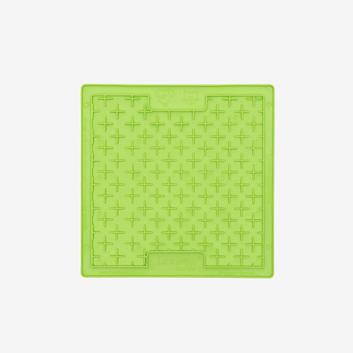 Bright green silicone pet feeding mat with a textured pattern of raised crosses, designed to catch spills and messes.