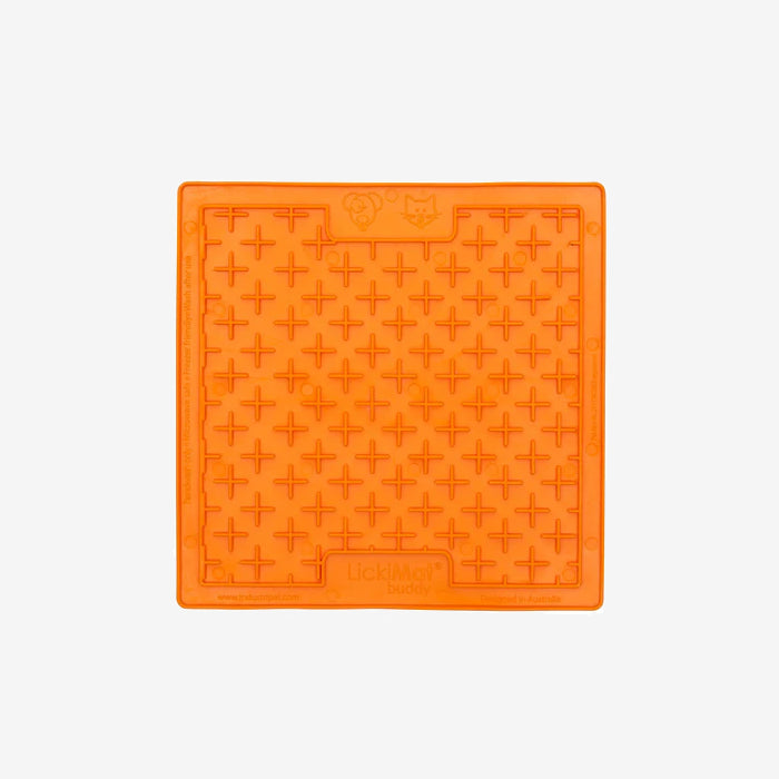 Bright orange silicone mat featuring a grid pattern of raised crosses, ideal for pet treat dispensing or licking activities.