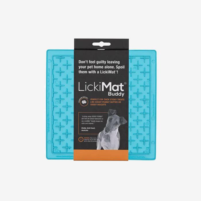 Bright blue LickiMat Buddy for pets, featuring a textured surface for holding treats, with a hanging tag detailing its use and benefits.