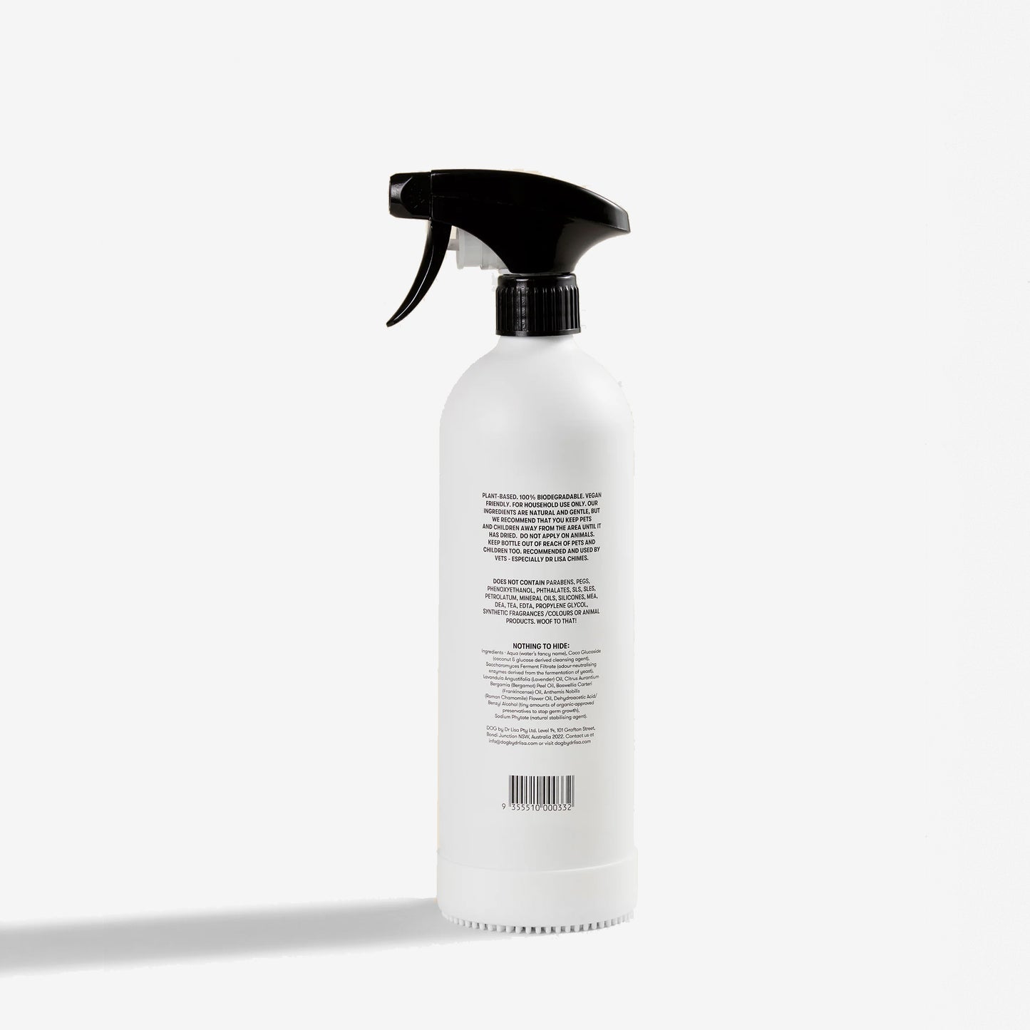 the back of a white cat wee cleaner spray bottle with an attaching brush at the base.