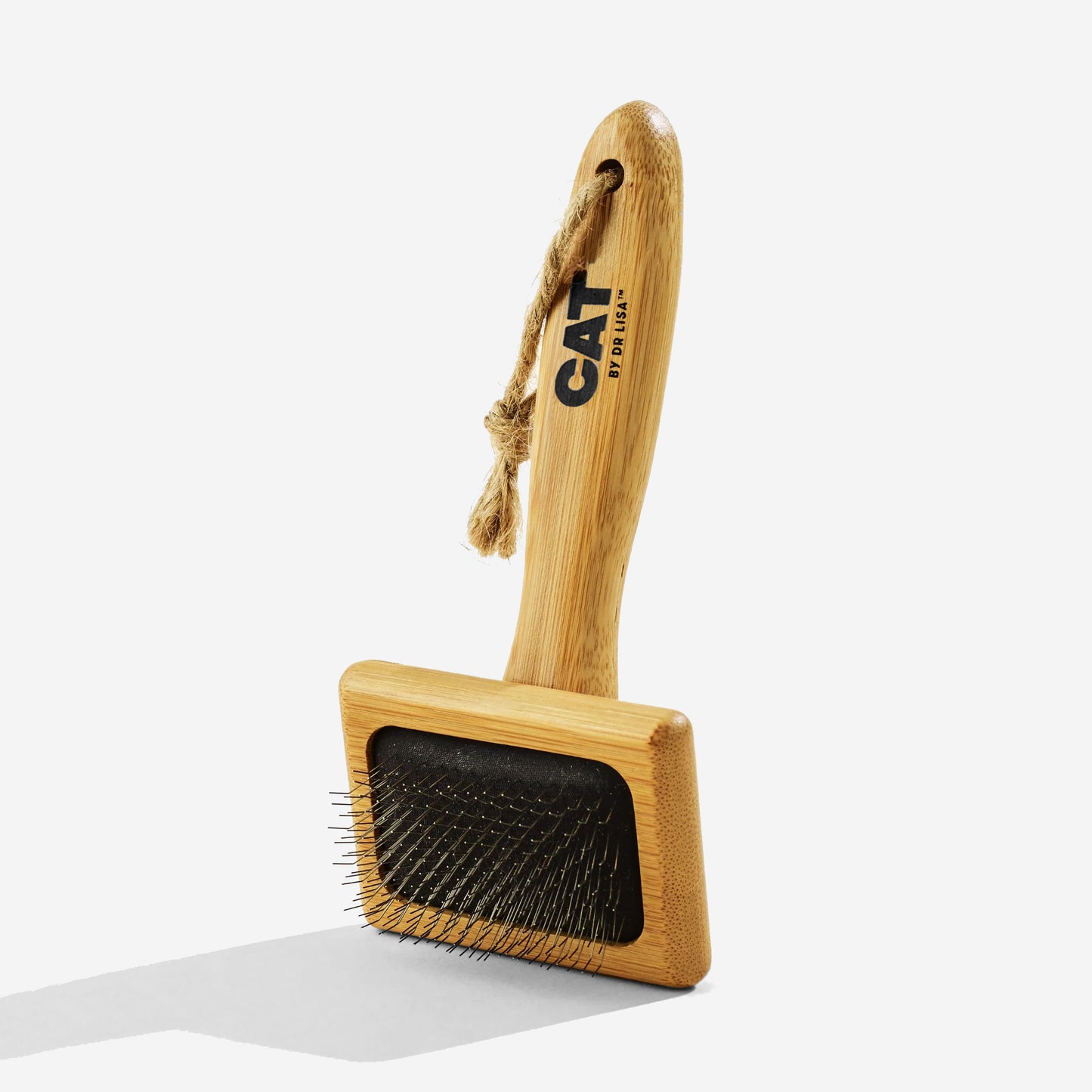 Wooden bamboo wire brush with a rope on the handle, isolated on a white background.