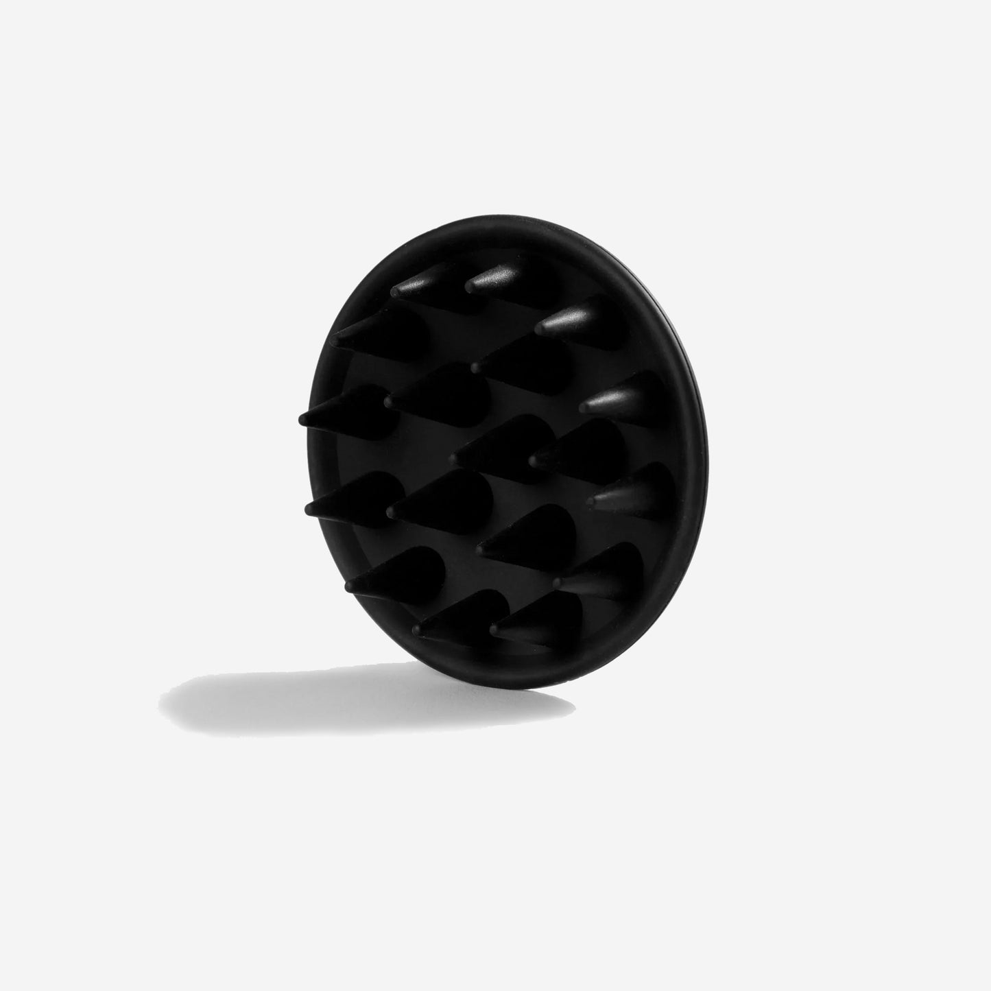 underneath view of a black silicone wash brush with white dog lettering