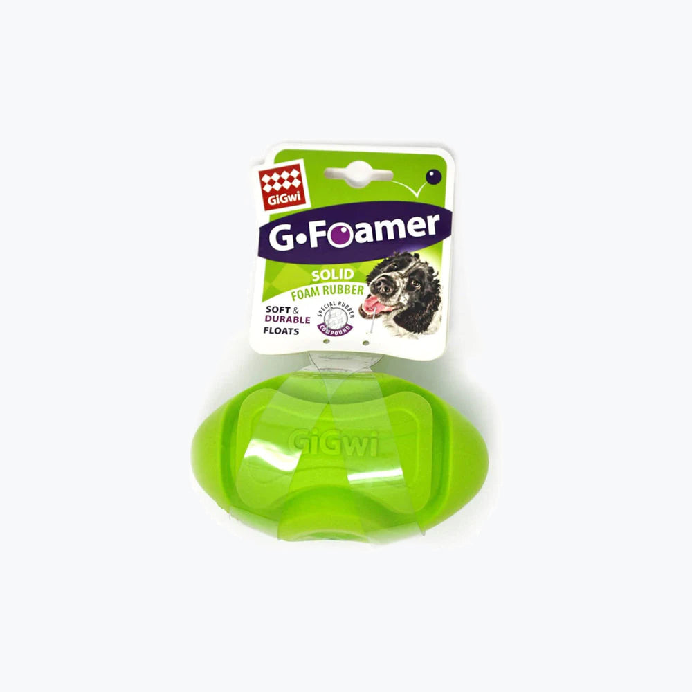 A green Gigwi G.Foamer dog toy made of solid foam rubber, labeled as soft, durable, and able to float.