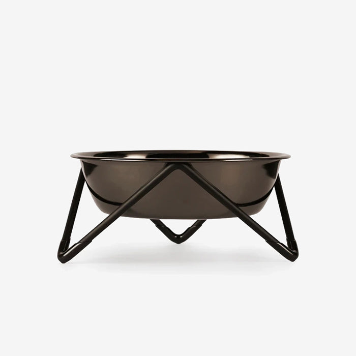 Nickel coloured pet bowl on a modern minimalist metallic black stand against a white background.