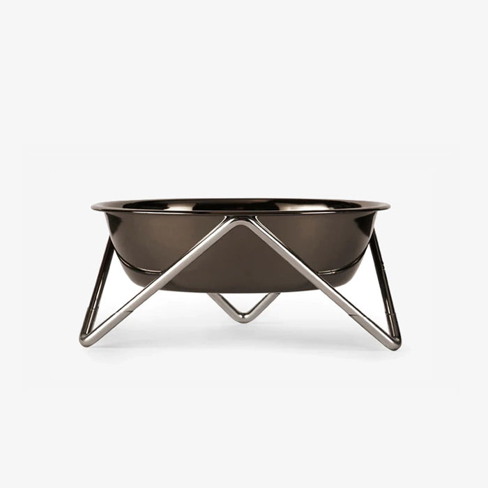 A sleek, modern fire pit with a glossy black bowl and minimalist silver tripod legs, ideal for outdoor gatherings.
