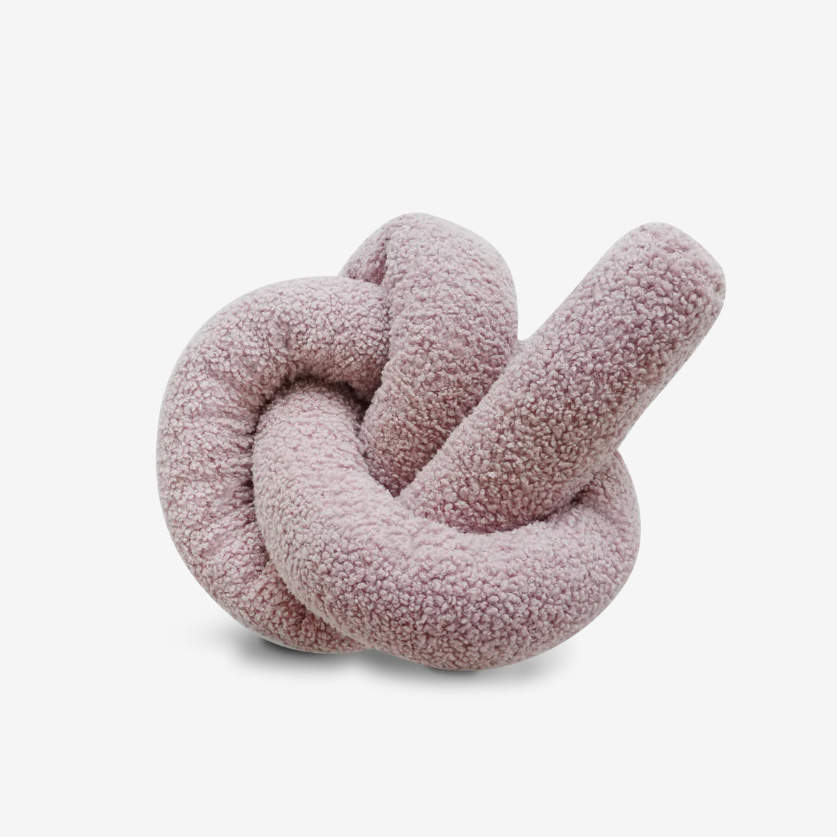 A plush, twisted knot-shaped sculpture in soft, muted pink fabric, resembling a cozy, abstract design element.