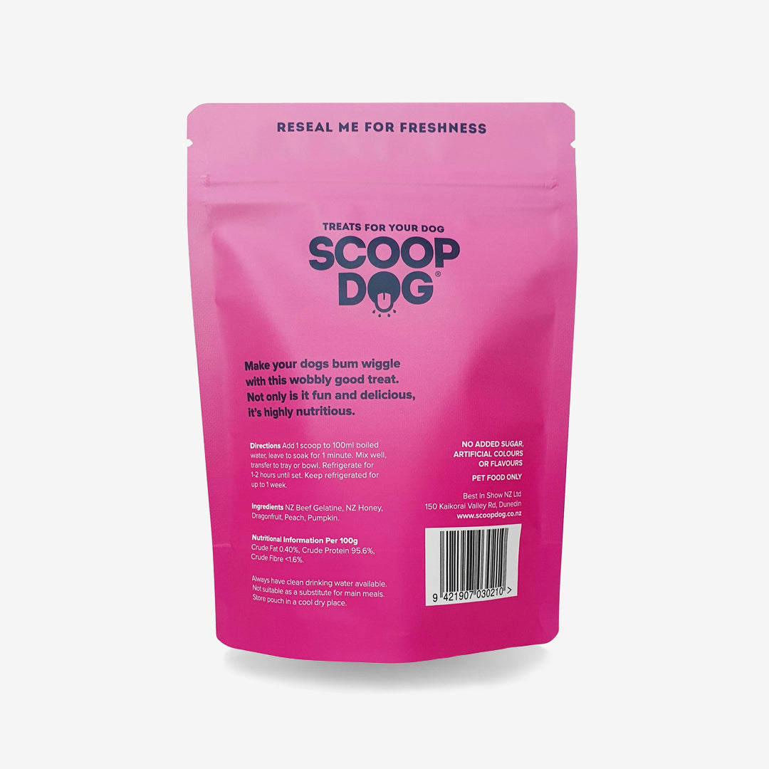 A pink dog treat package labeled "SCOOP DOG" with nutritional and preparation instructions.