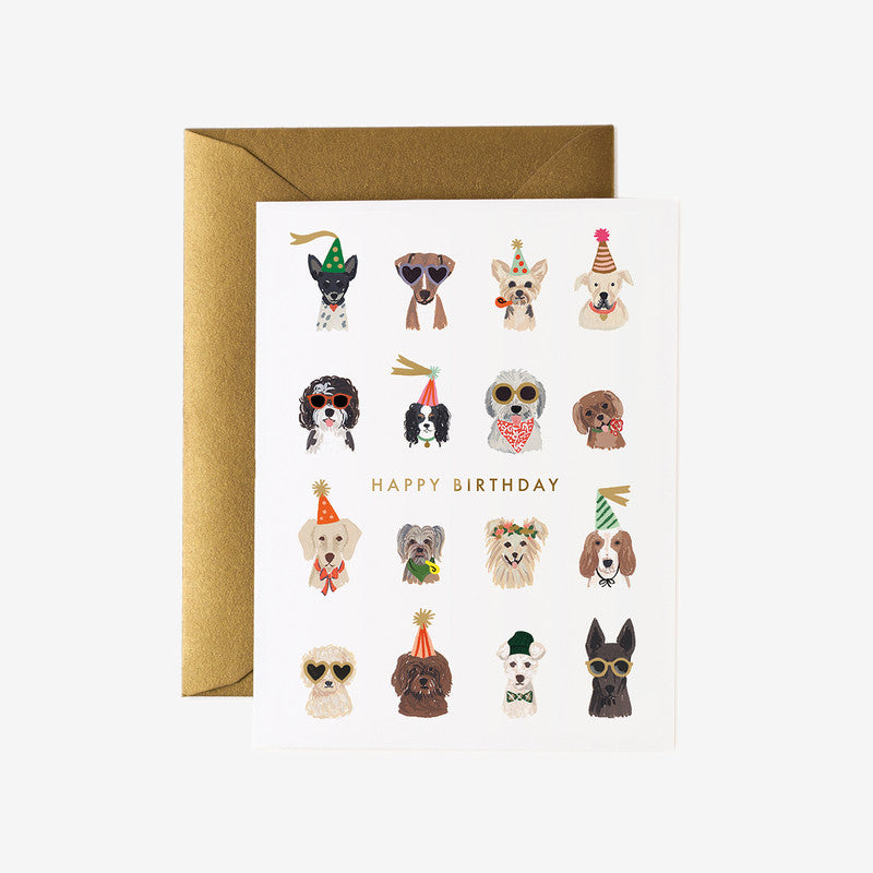 A colourful birthday card featuring playful dog illustrations wearing festive hats, with the text "HAPPY BIRTHDAY" in gold.