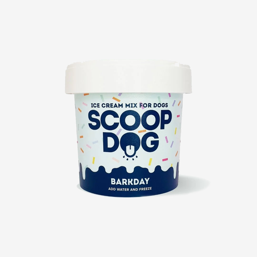 A container of "Scoop Dog" ice cream mix for dogs, with instructions to add water and freeze.