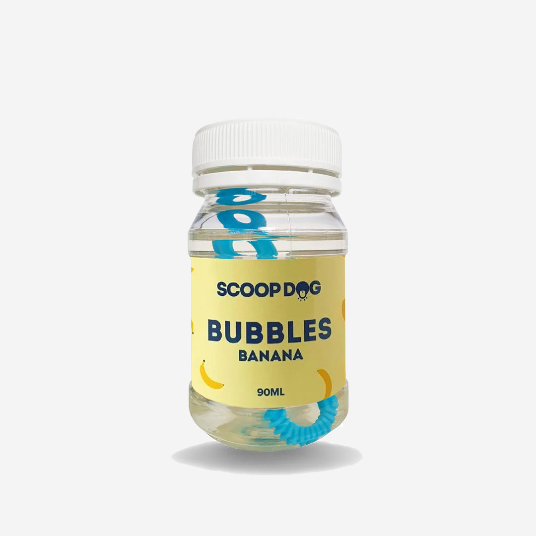 A bottle of ScoopDog banana-flavoured bubbles, 90ml, with a blue bubble wand.