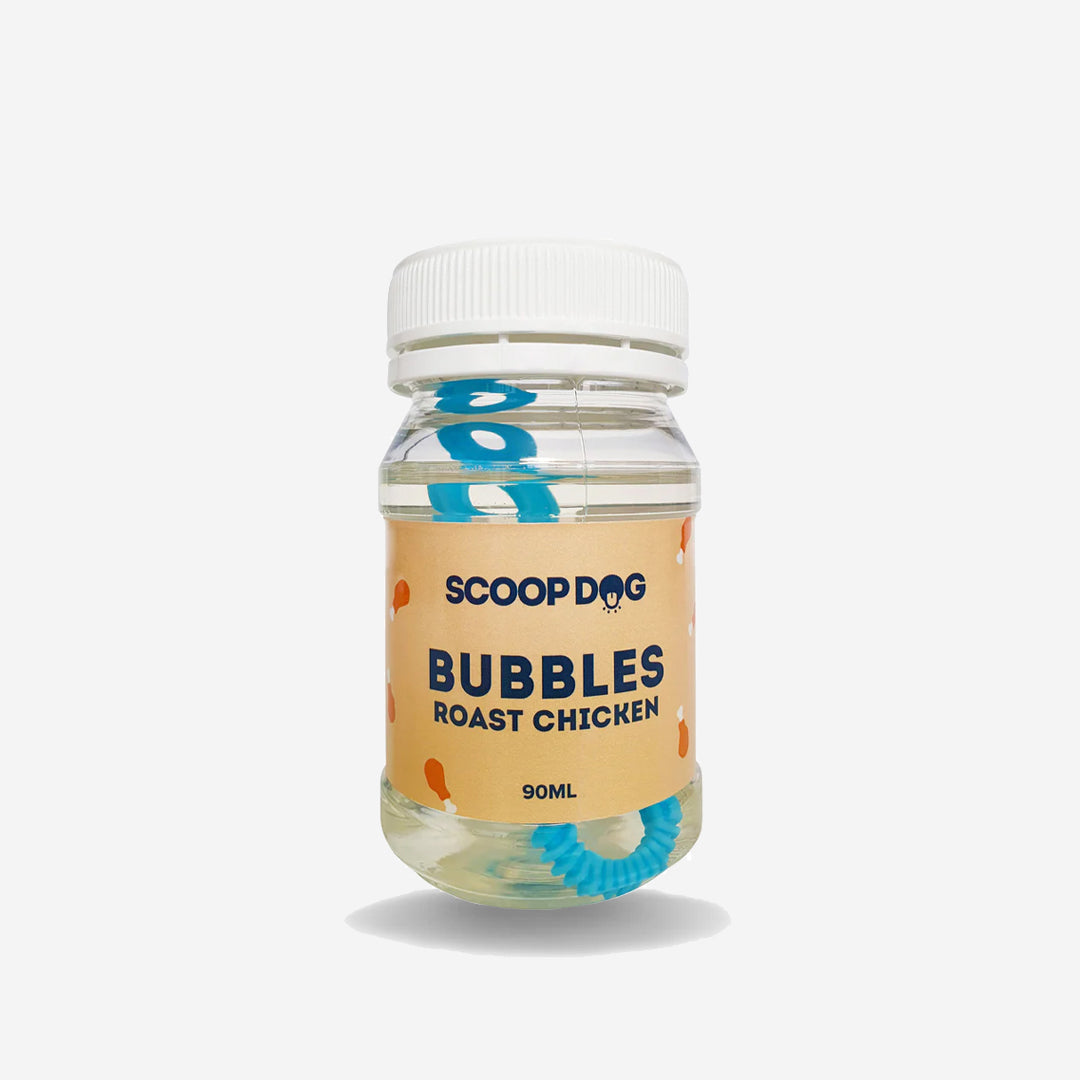 A jar labeled "SCOOPDOG BUBBLES Roast Chicken 90ML" with a blue wand inside, on a white background.