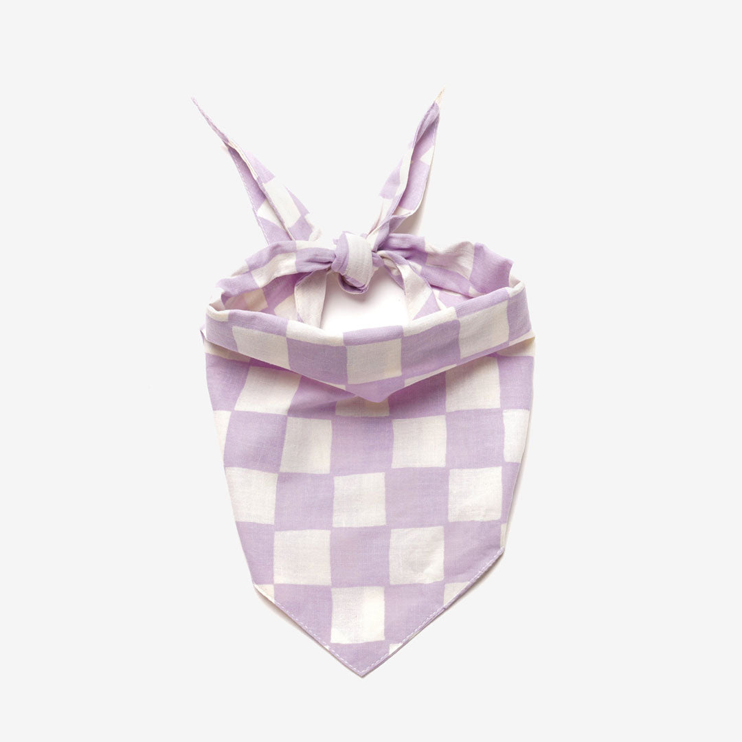 A lilac and white checkered dog bandana, tied neatly on a white background.