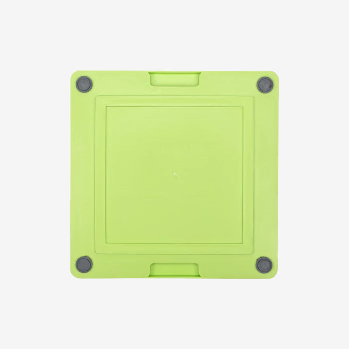 Lime Green square silicone lickimat with rounded corners, featuring a centre indentation and rubber grips on each corner.
