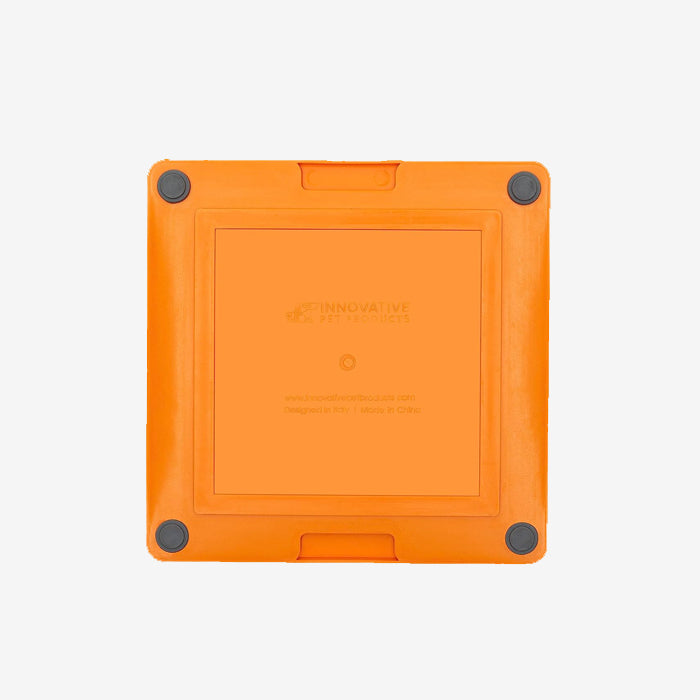 Orange removable pet silicone lickimat mat container with rounded corners and a clean, simple design with 4 rubber dots in each corner.