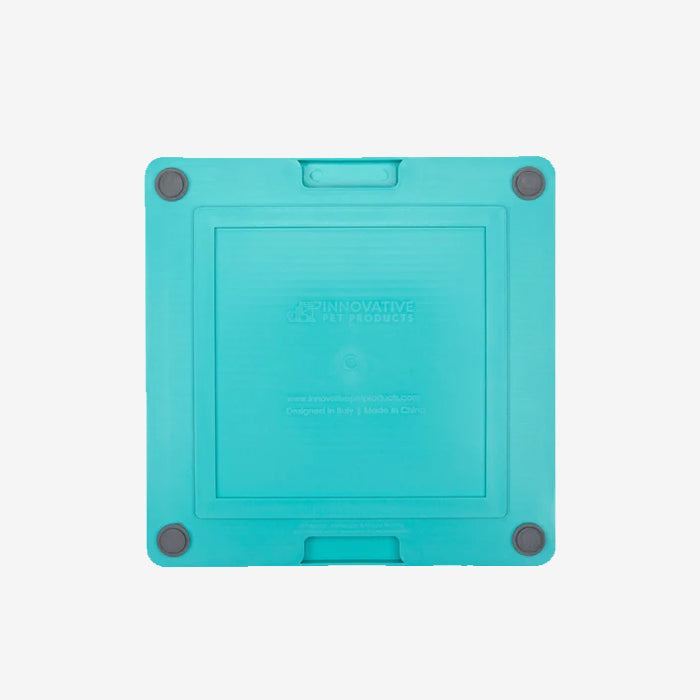 Turquoise removable pet silicone lickimat mat container with rounded corners and a clean, simple design with 4 rubber dots in each corner.