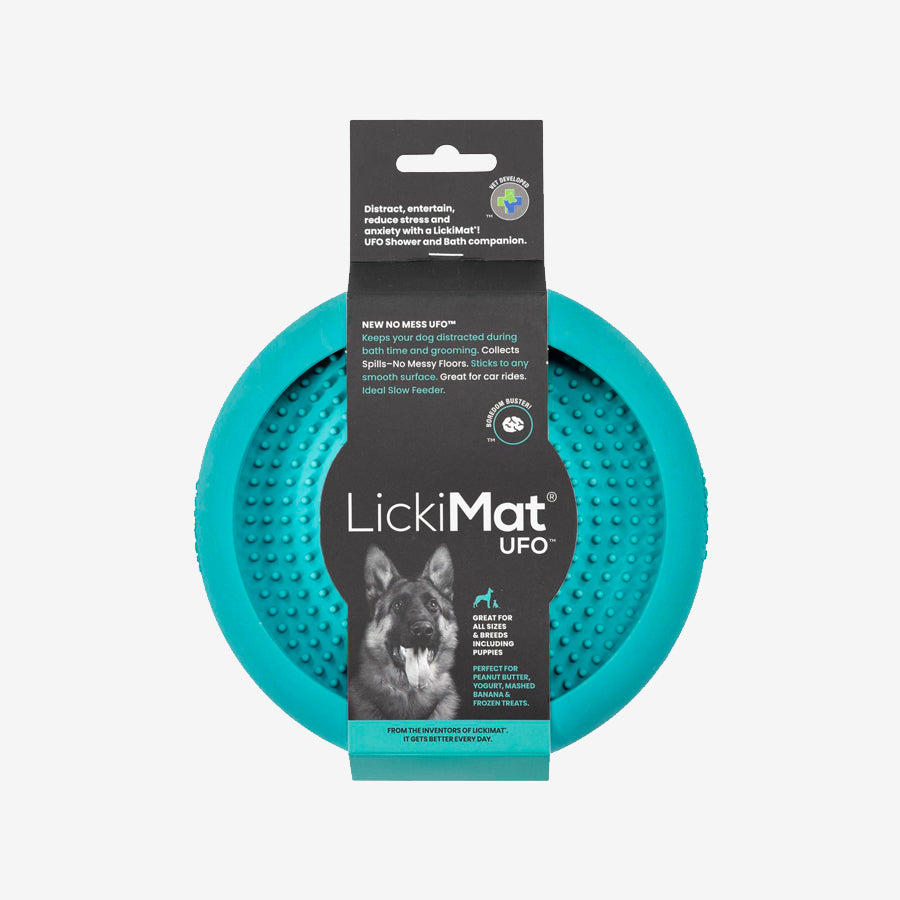 A turquoise LickiMat UFO, designed to keep dogs distracted during baths, features textured surfaces for spreading treats.