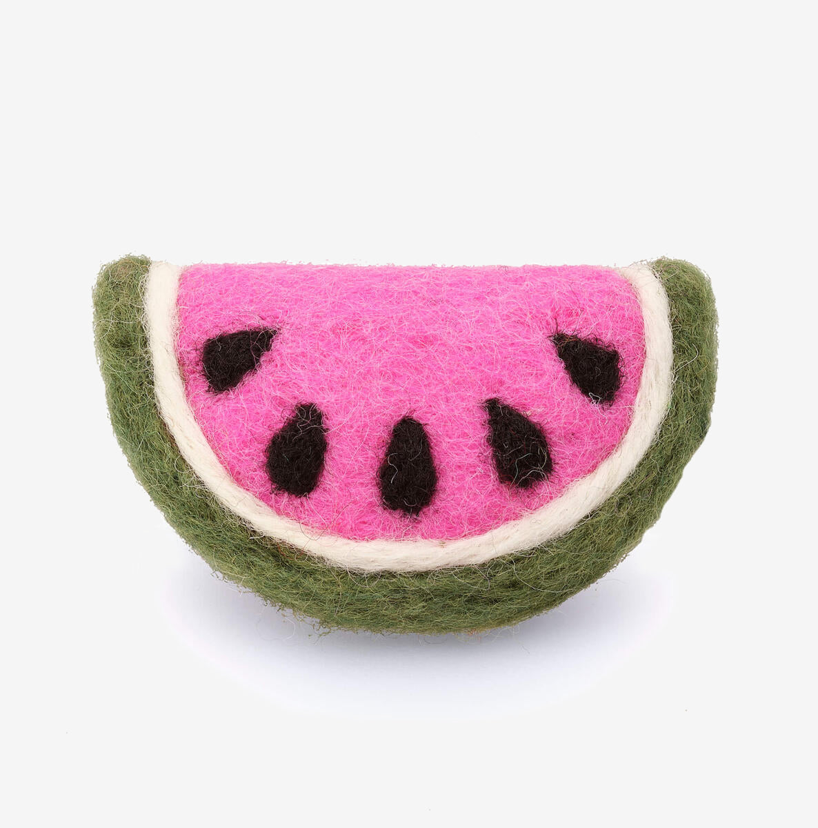 A felted wool craft cat toy resembling a slice of watermelon with pink flesh and black seeds on a white background.