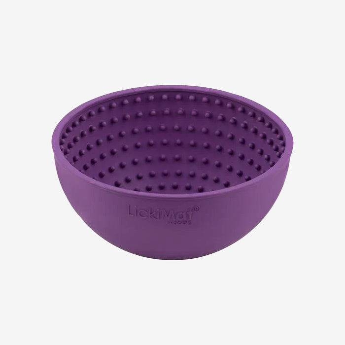 Purple silicone bowl designed for pets, featuring raised dots inside for interactive licking and engagement during meal or treat time.