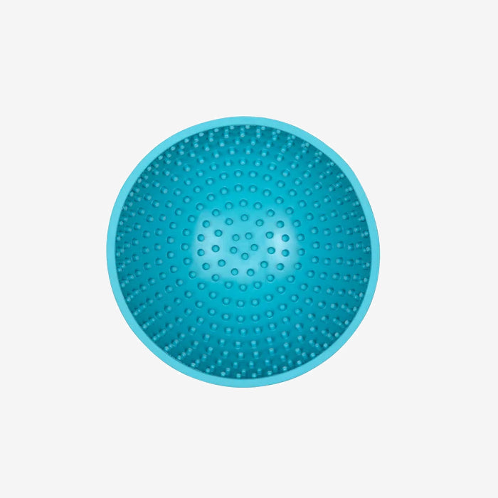A top-down view of a textured, round, blue massage ball with small protrusions for tactile stimulation and relaxation.