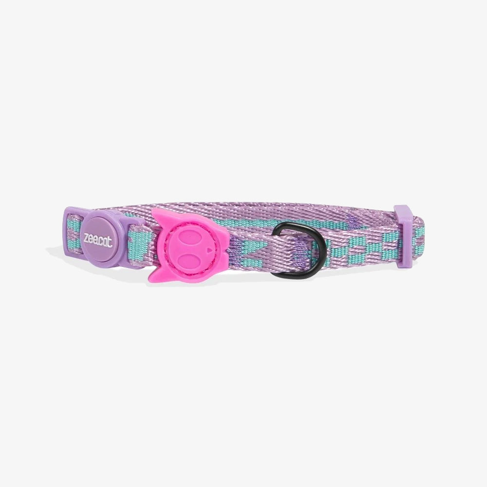 A purple and teal patterned cat collar with a pink breakaway buckle and a tag ring.