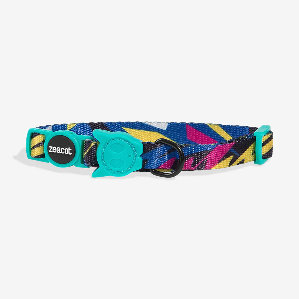Colourful cat collar featuring a blue, yellow, and pink geometric pattern, with a cute teal buckle and "zee.cat" logo.