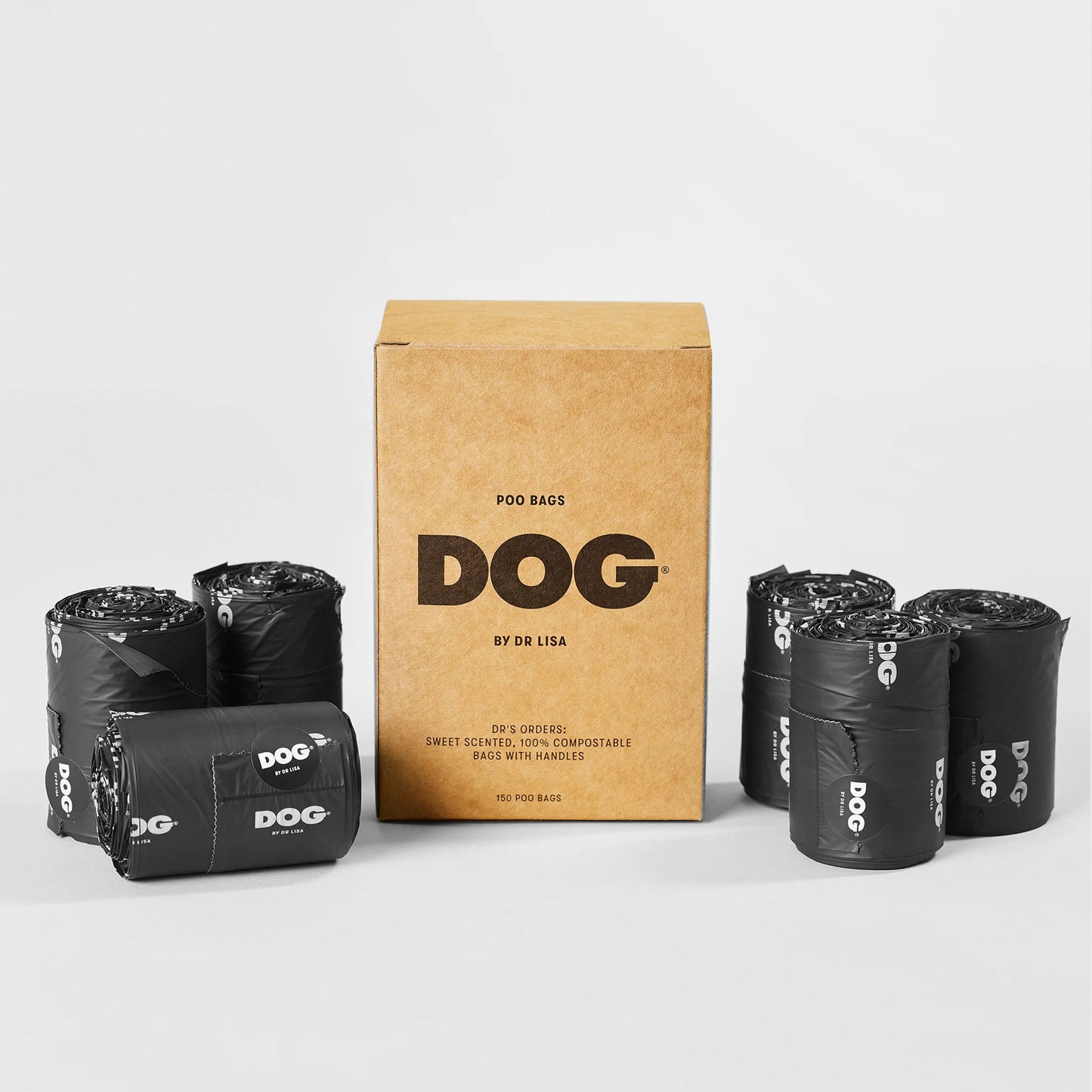 A cardboard box labelled " Dog by Dr Lisa" and rolls of black dog poo bags with "DOG" branding on a light background.