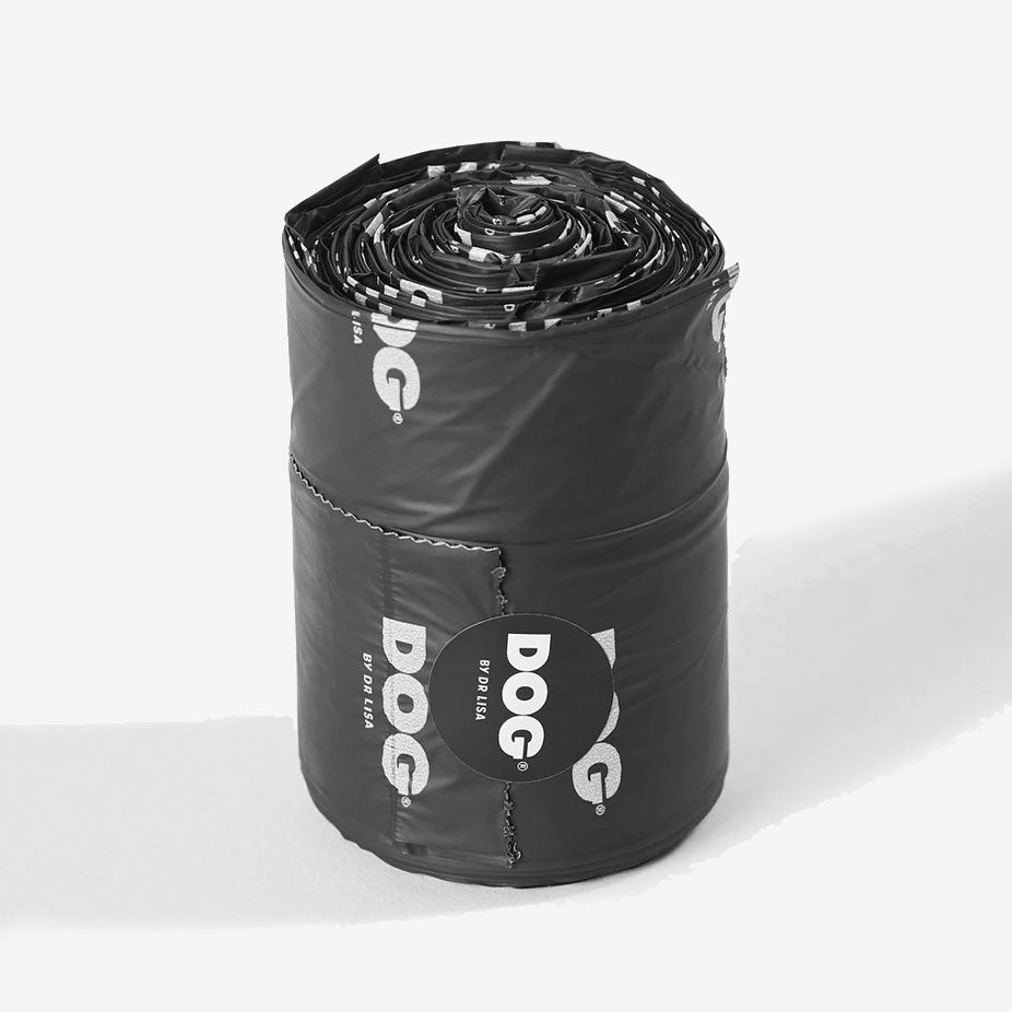 A roll of dog waste bags with visible branding on a white background.