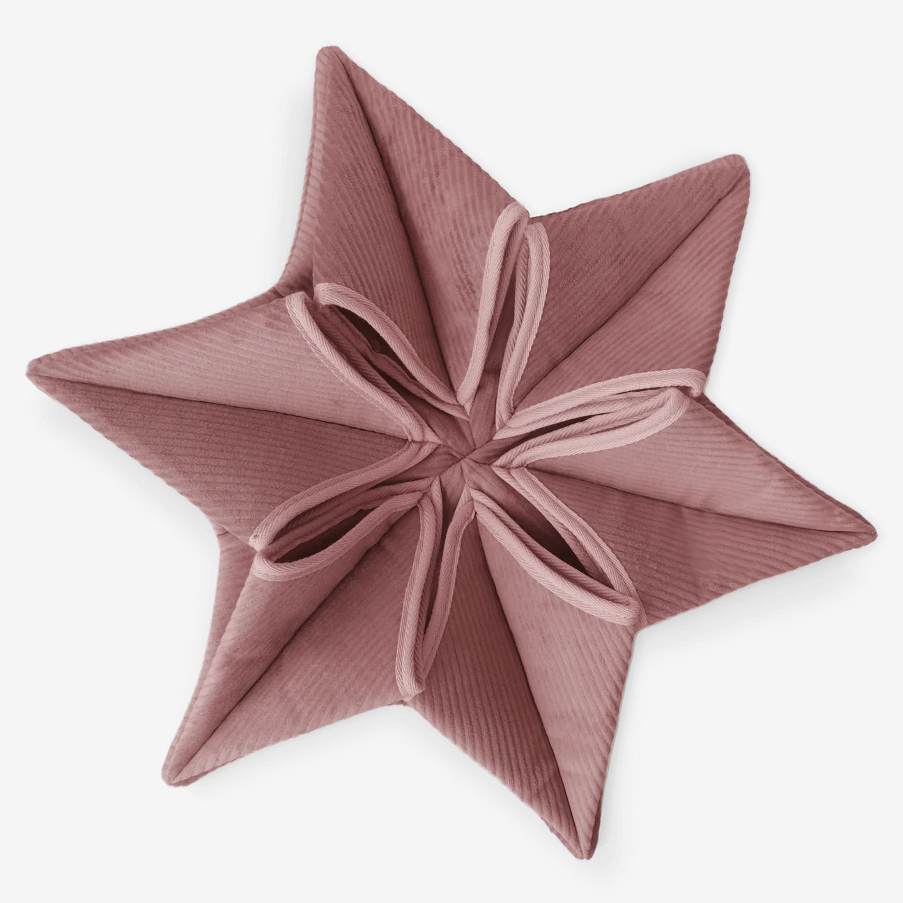 Close up of "Lambwolf Collective's" large flower shaped snuffle matt in dusky pink, sitting on a white background.