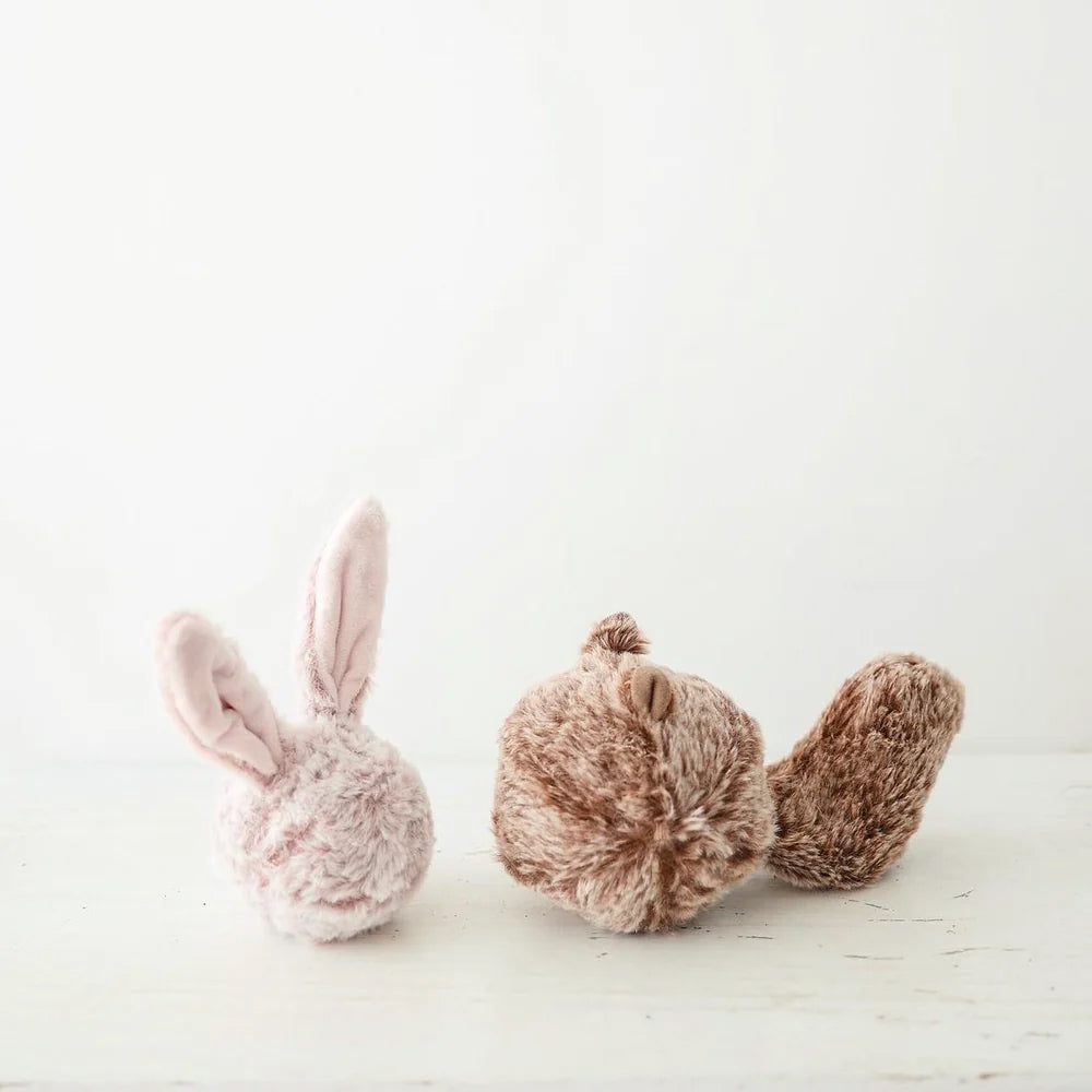 Two plush toys: a round, soft pink bunny with long ears and a brown squirrel with a curled tail, set against a white background.