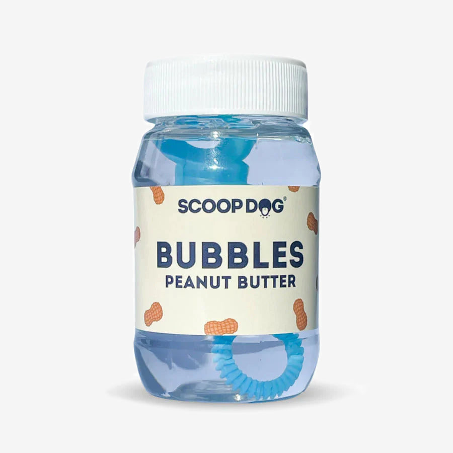 A bottle of ScoopDog peanut butter -flavoured bubbles, 90ml, with a blue bubble wand.