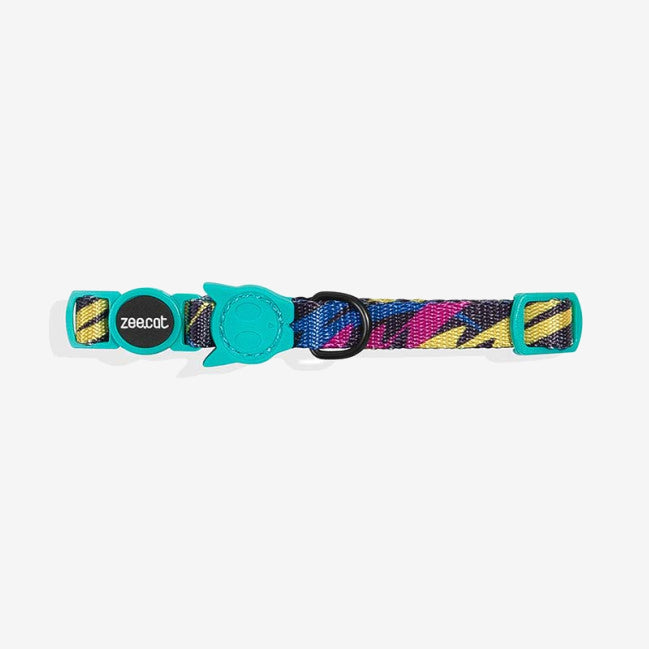 Colourful cat collar featuring a pattern of vibrant stripes and a turquoise fastening, with branding on a circular tag.