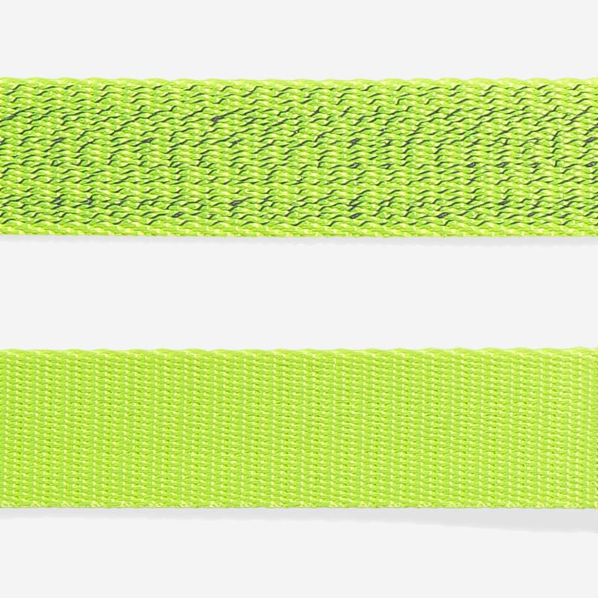Two green straps, one with a textured weave and the other with a smooth, flat surface, displayed against a white background.