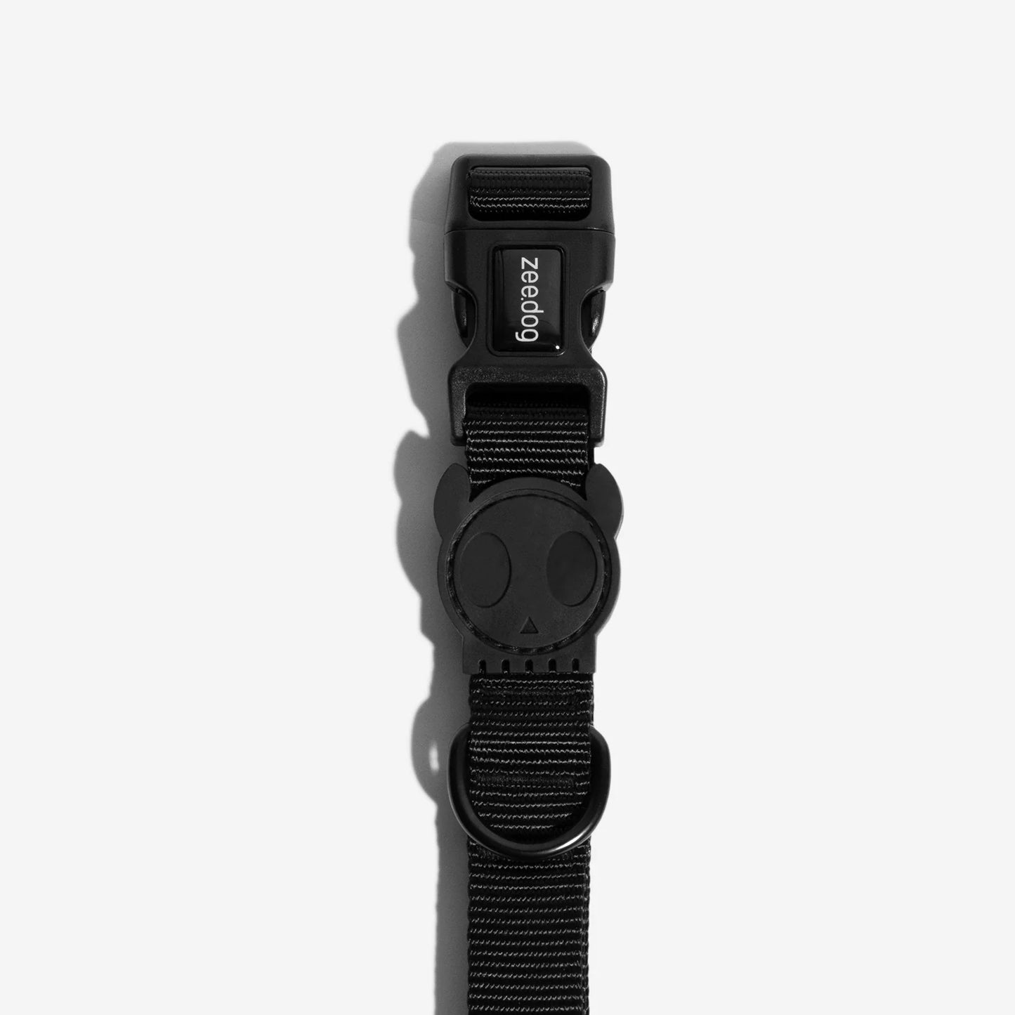 Black dog leash featuring a playful skull-shaped design, adjustable clip, and a sturdy loop for attaching accessories.