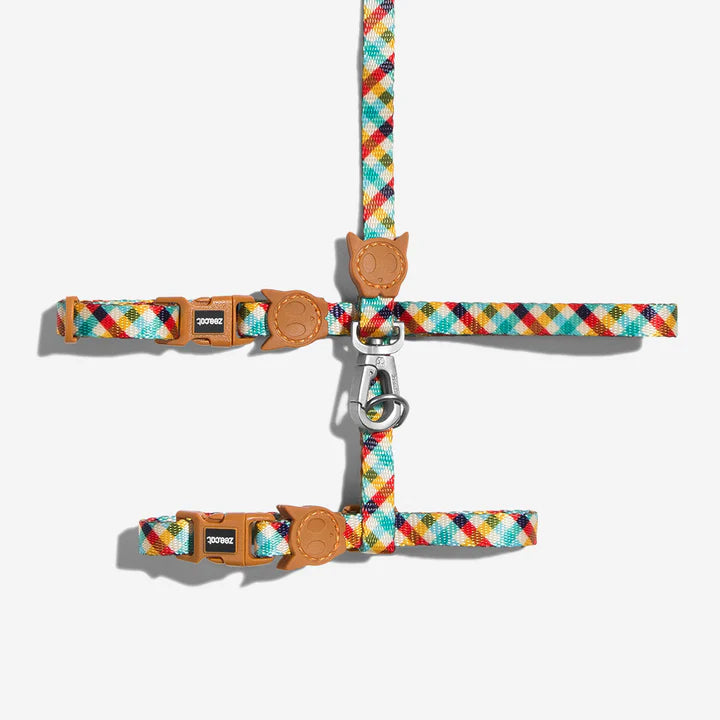 Colourful diamond patterned cat leash with brown clips and a aluminium hook, on a white background.