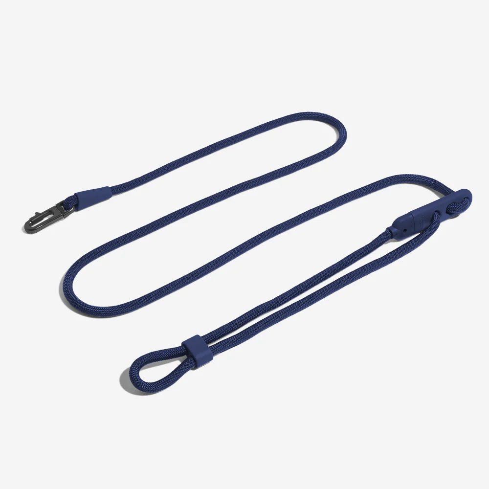 A navy blue, textured rope dog lead with a clip on one end and a loop handle on the other.