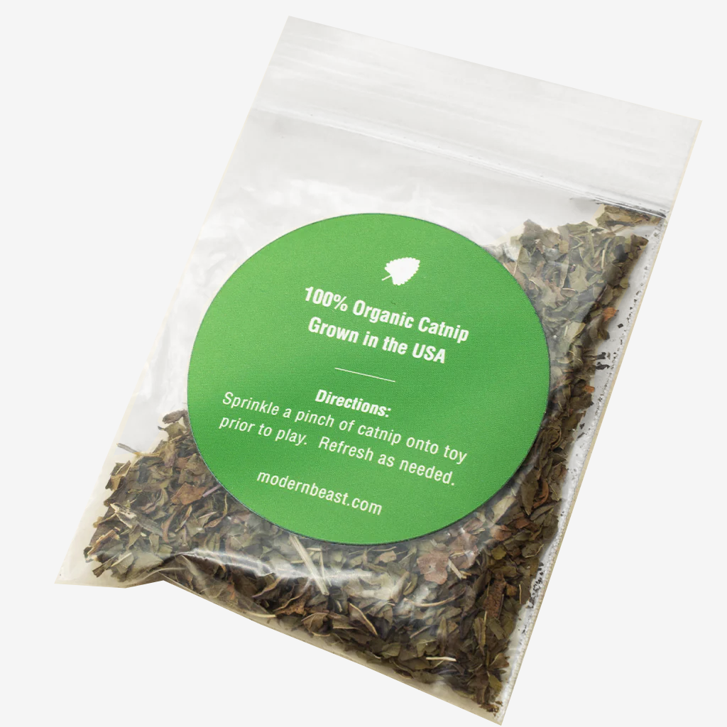 Package of 100% organic catnip, labeled "Grown in the USA," with usage directions printed on a green circular label.