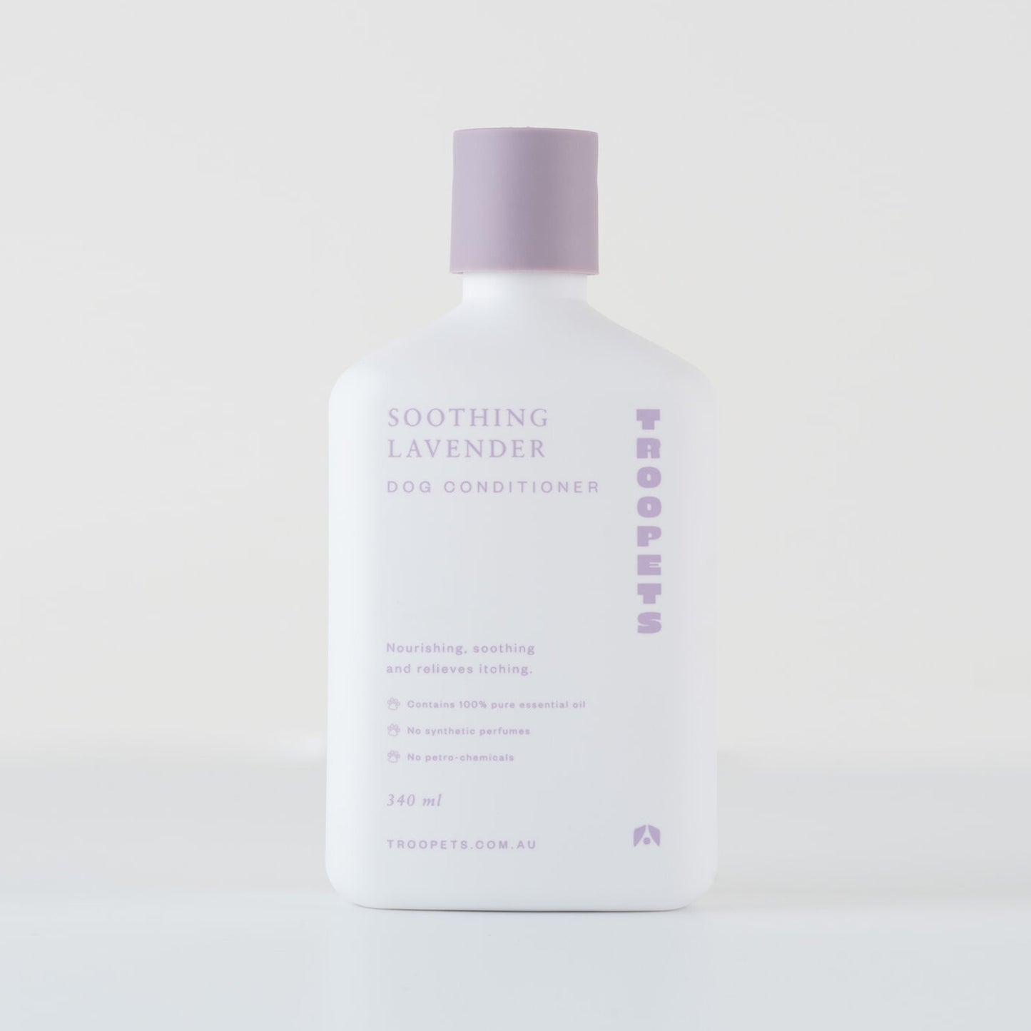 White bottle of Troopets Soothing Lavender Dog Conditioner with a lavender cap, featuring essential oil and soothing properties.