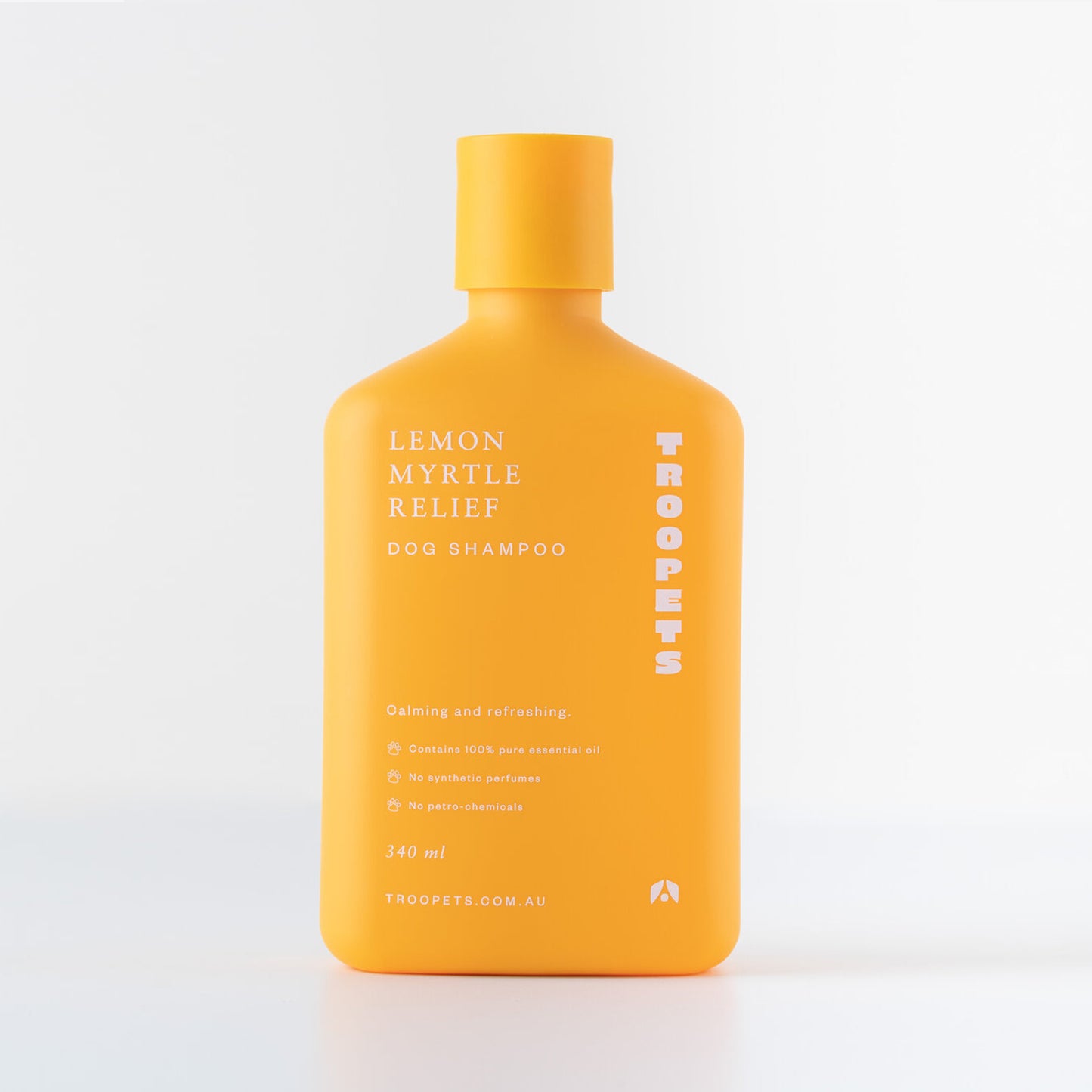 Bright yellow bottle of Troopets Lemon Myrtle Relief Dog Shampoo, featuring eco-friendly ingredients and calming properties.