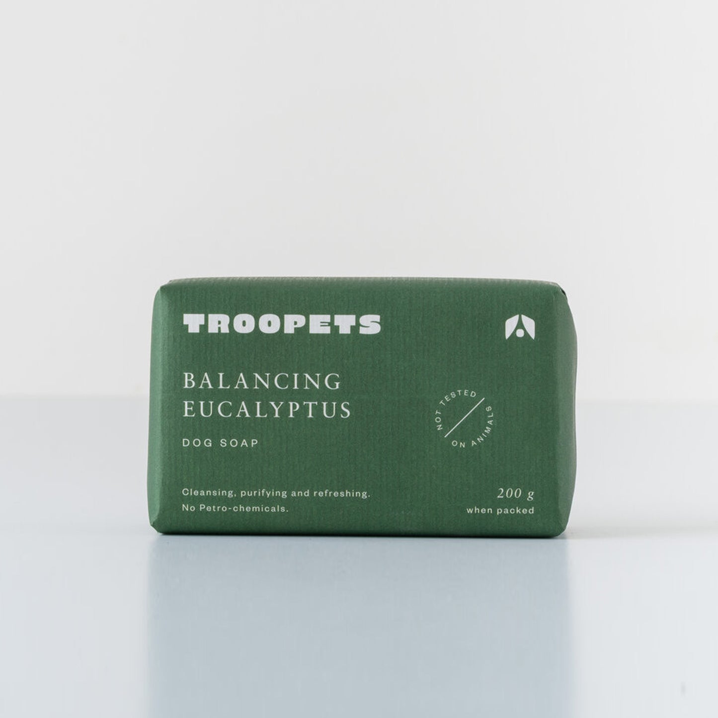 Green box of 'TROOPETS' eucalyptus dog soap on a white background.