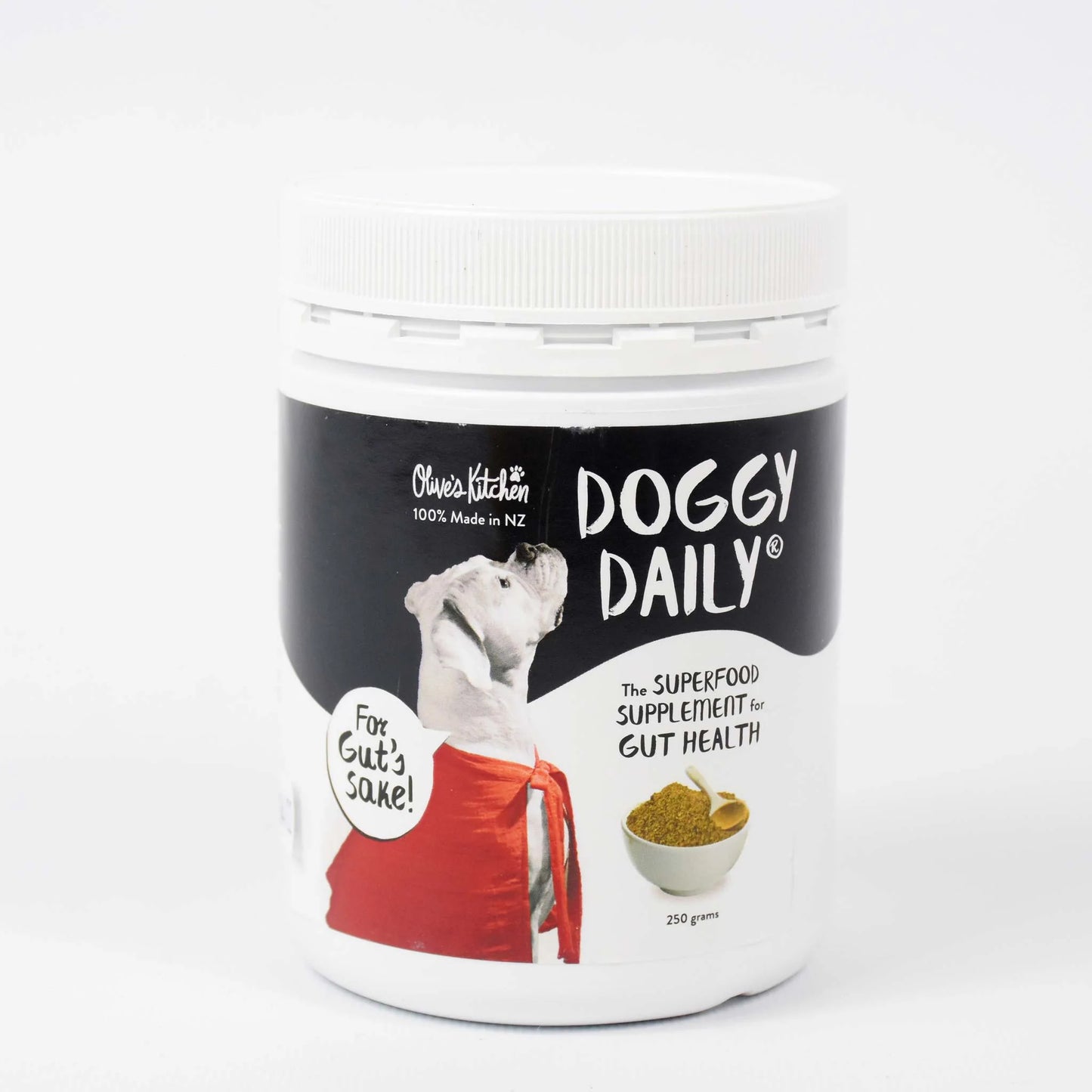 White container labeled "Doggy Daily" with an image of a dog, promoting a gut health superfood supplement. Made in New Zealand.