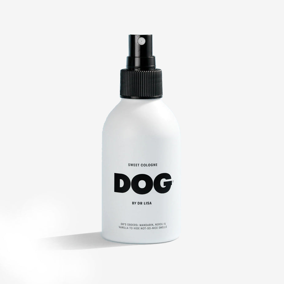 the front of a white dog sweet scented cologne bottle with a black spray nozzle 