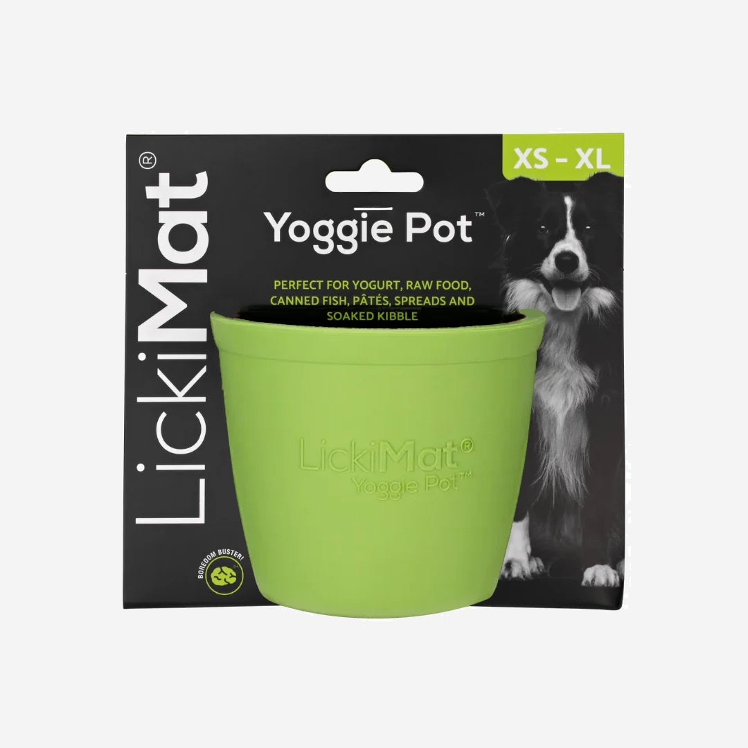 Lime green textured Licki Mat dog feeding pot, with raised bumps inside, on a plain background.