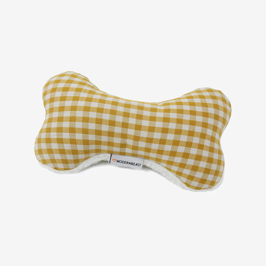 Yellow and white checkered dog bone-shaped plush toy with a soft backing, featuring the Modern Beast logo.