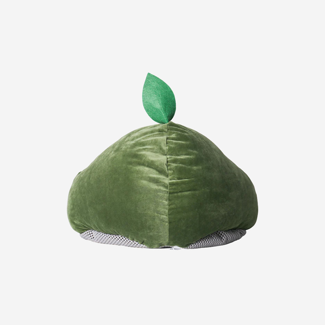 A plush avocado-shaped pet bed with a green outer layer, a brown round cushion inside, and a small green leaf on top.